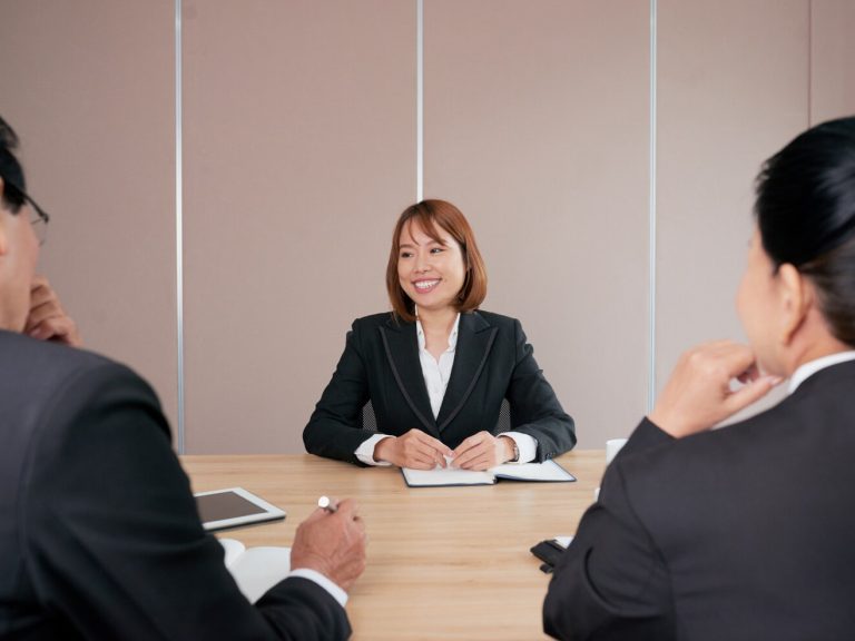confident-asian-businesswoman-sitting-meeting-office-smiling_1098-18577